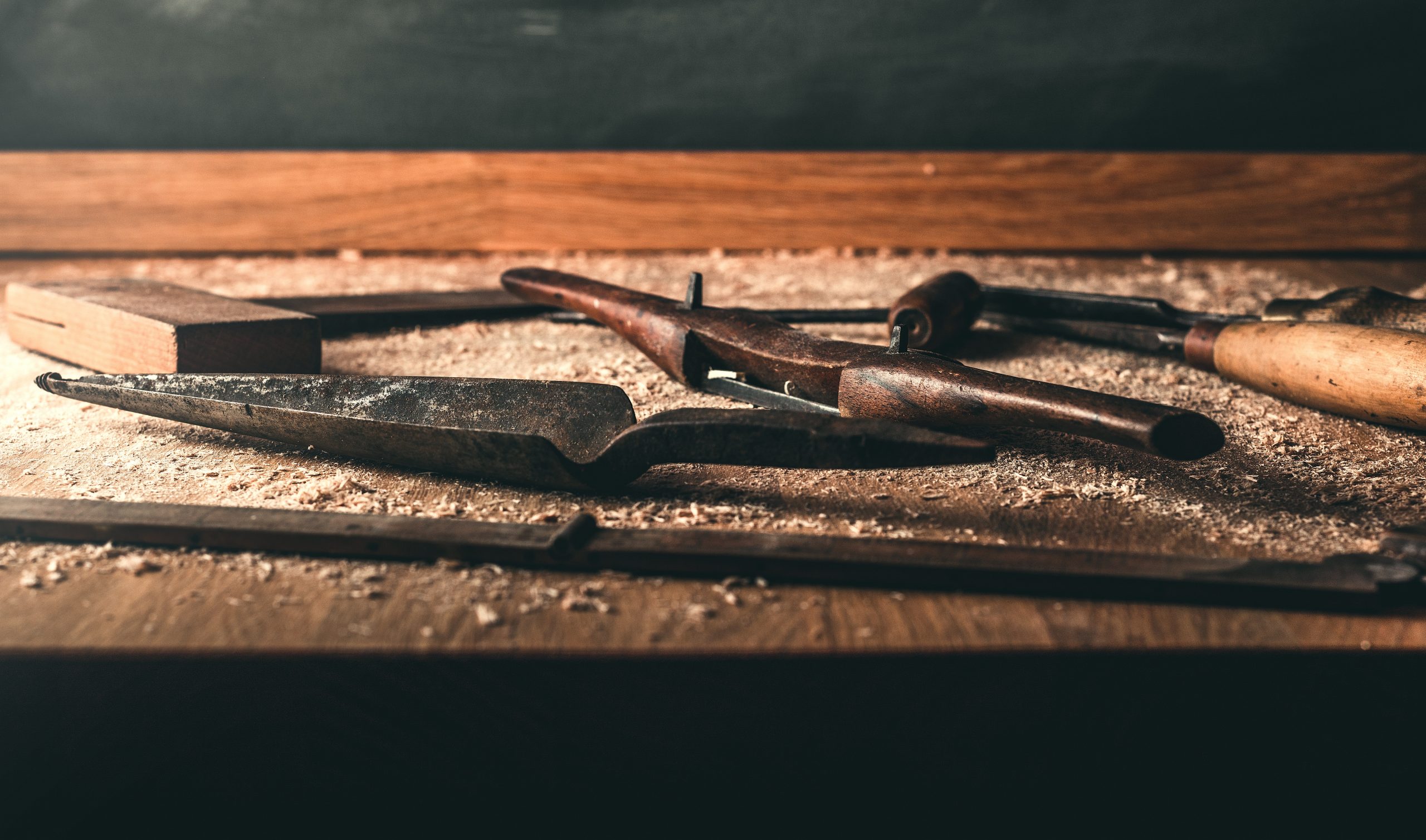 Timber framing tools lying on workbench